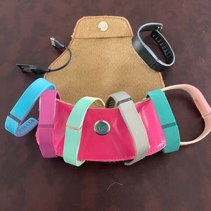 Set of Seven fit bit bands and charger